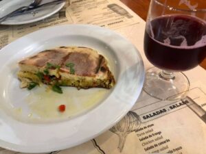 Photo: Half-eaten cheese bread and glass of red sangria, Furnas, the Azores. Photo by World's Worst Food Blogger